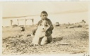 Image of Tom Gear's little boy and Eskimo [Inuit] dog